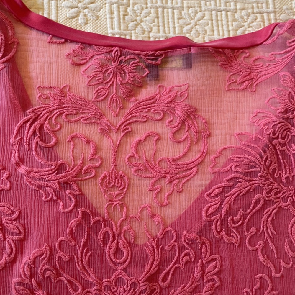 Silky coral colored tee w/ sheer embroidered back.